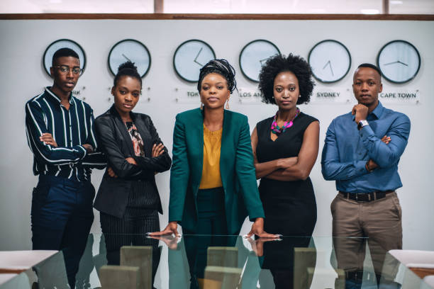 Portrait of young business team standing in the office.